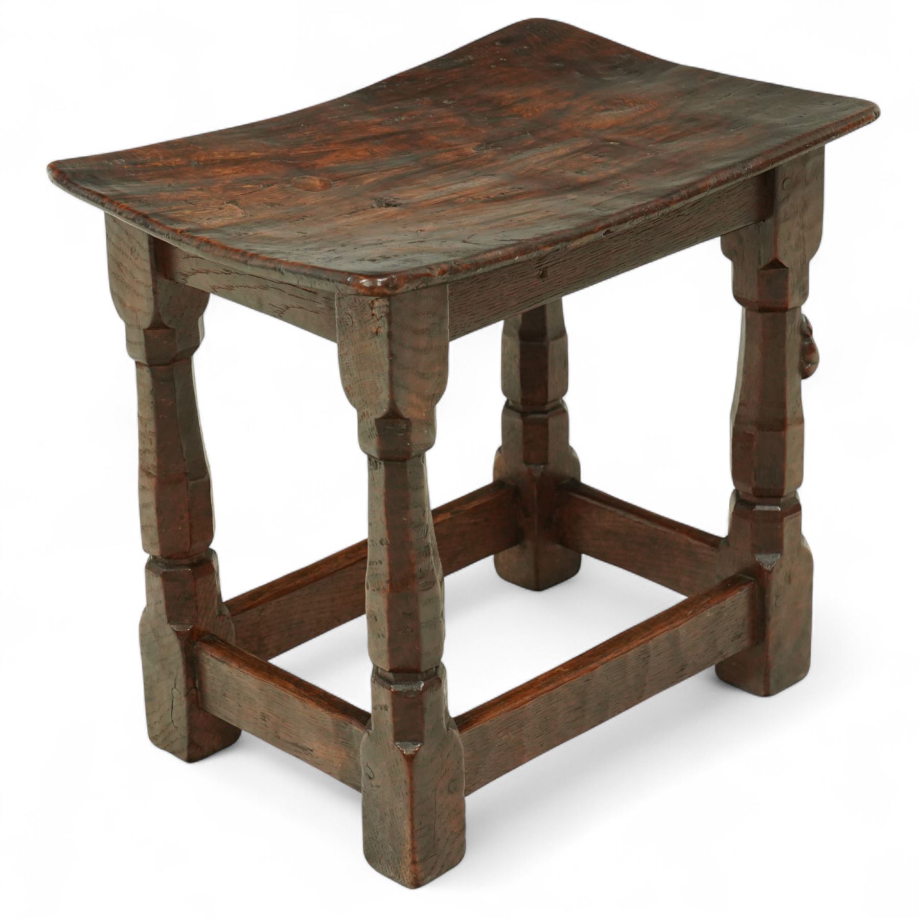 Mouseman - 1930s adzed oak joint stool, dished figured burr oak seat, on shaped octagonal supports joined by stretchers, carved with mouse signature, by Robert Thompson of Kilburn