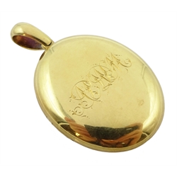  18ct gold oval hinged locket pendant, engraved initials on both sides, stamped 18 makers marks AD  