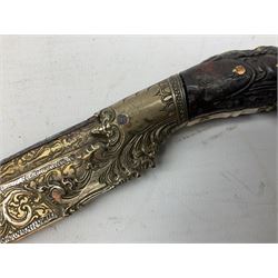 19th century Singhalese knife pia kaetta, the 20cm steel blade inset with yellow and white metal, with metal mounted carved pistol grip, in plain wooden scabbard L33cm overall