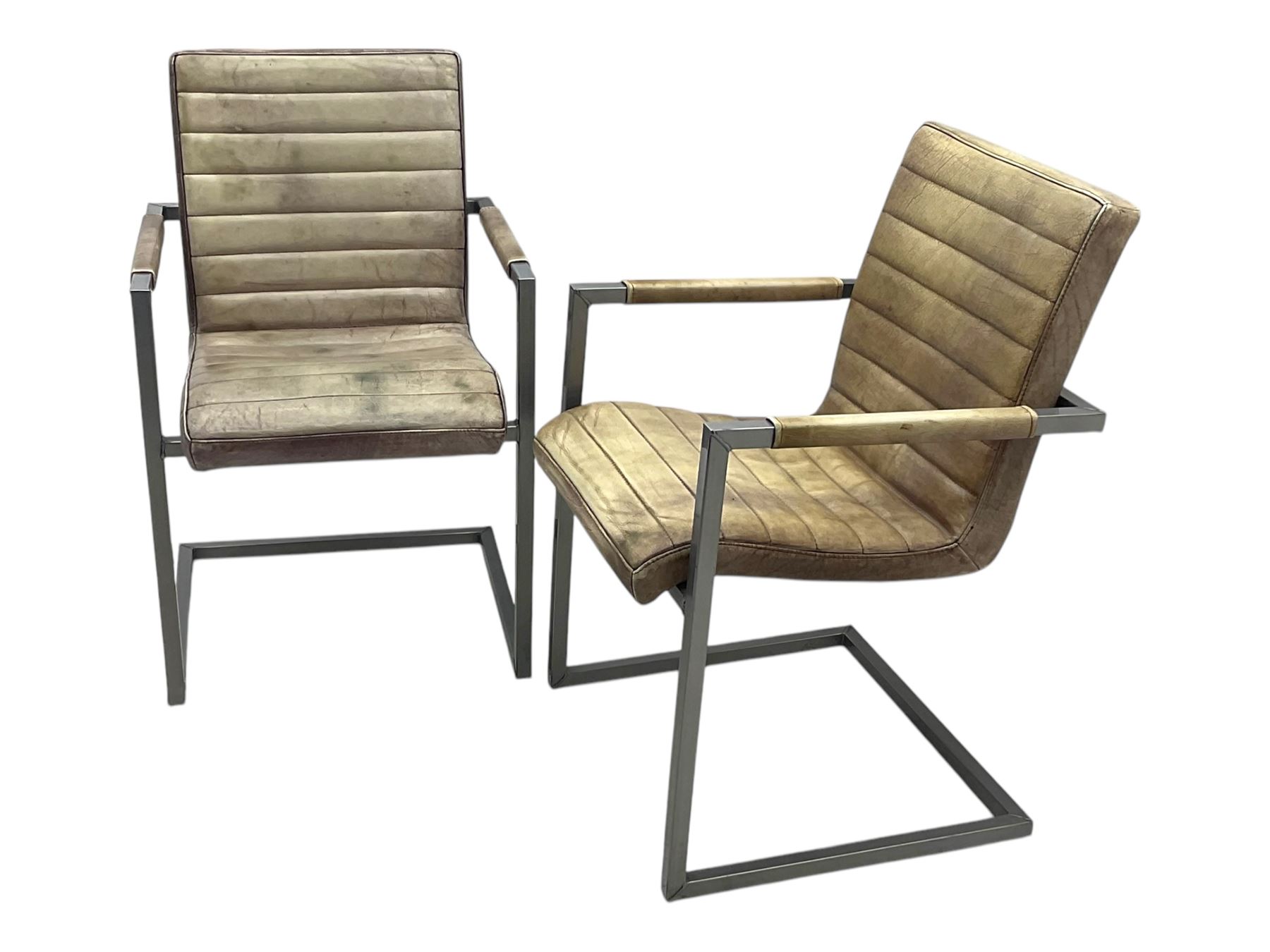 Pair of contemporary industrial style armchairs, each featuring a squared steel cantilever frame with upholstered arms, the seat and back finished in channel-stitched distressed tan faux leather