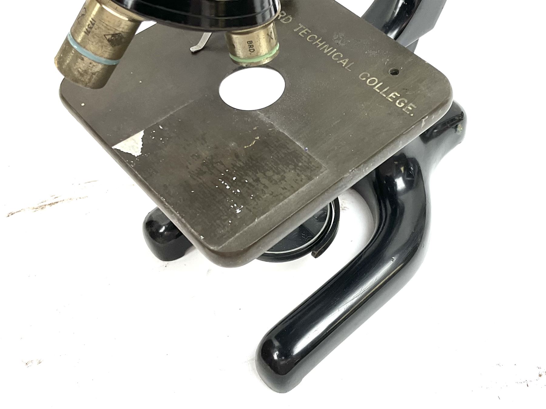 Black finished monocular microscope by Prior London No. 17372,  with pitchfork base and rack and pinion focusing, in original fitted wooden case with additional lenses, H32cm, together with Watts dumpy level, no. 116249, in a leather case