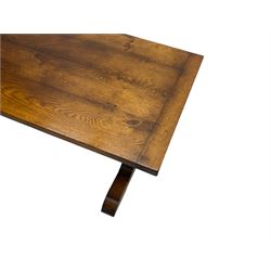 Dorset Oak - large refectory dining table, rectangular plank top, raised on shaped end supports with sledge feet, united by stretcher
