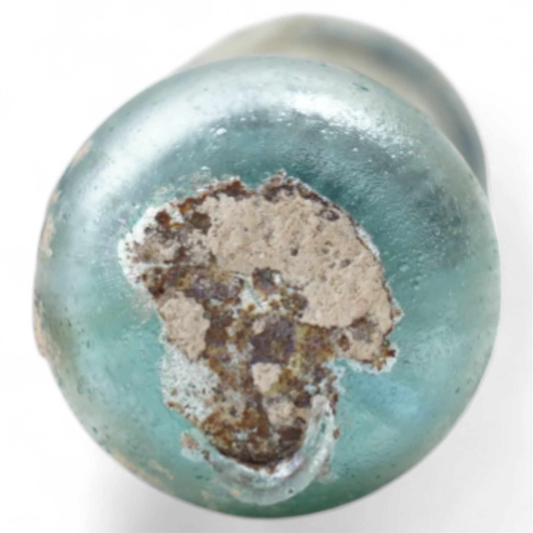 Three Roman glass funerary vessels c. 1st-3rd century AD, comprising a group of free-blown glass vessels: two unguentaria with elongated necks and rounded bases, and one squat lachrymatory or tear bottle, heights: 7.5cm, 6.5cm and 5cm
Notes: Unguentaria held oils/perfumes; small bottles of this type are traditionally described as ‘lachrymatories’, though their practical use is generally associated with unguents
Provenance: By the vendor’s repute, acquired/collected in the Middle East (Dead Sea area/Syria) in the 1960s