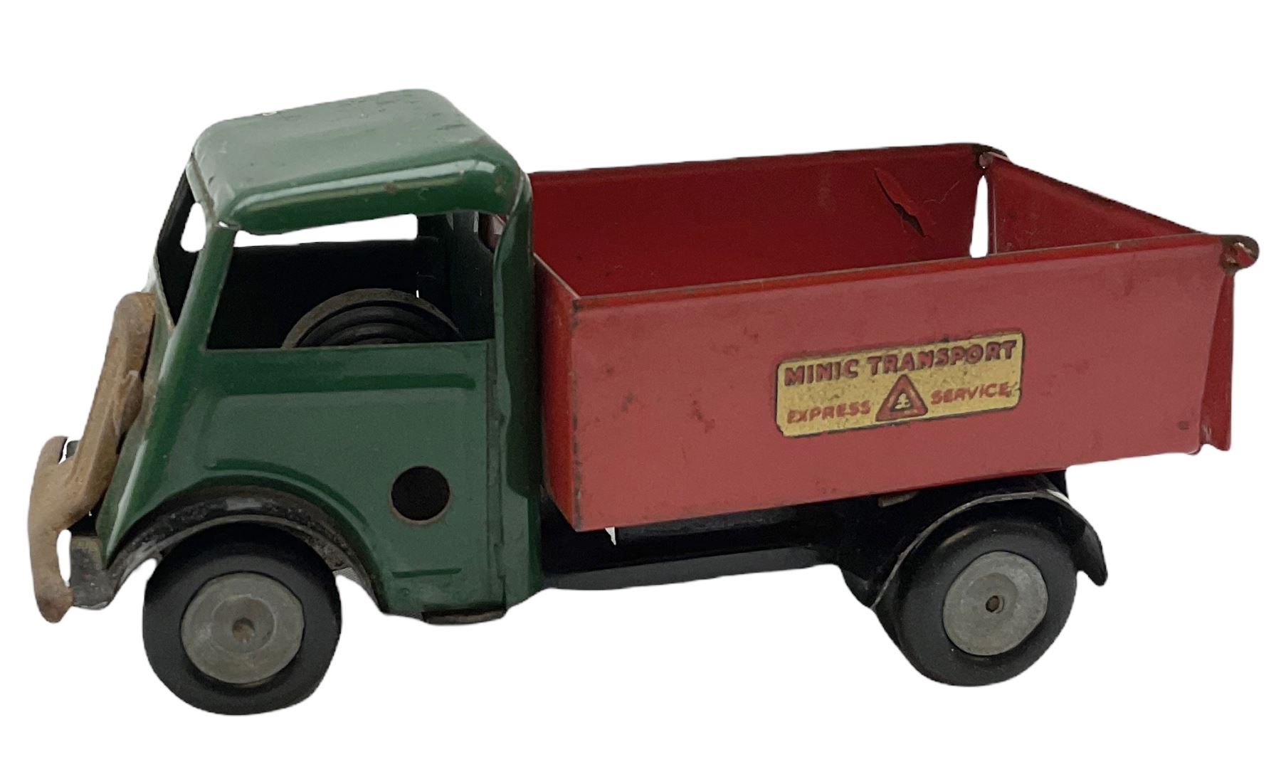 Eight Tri-ang Minic tin-plate/plastic clockwork vehicles comprising Tipper Lorry, Post Office Telephones Van, Caterpillar Tractor, Evening News Van, two Royal Mail Vans, American jeep and saloon car; all unboxed (8)