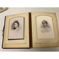 Victorian photograph album with ornately gilded and hand painted covers and brass clasp, partially stocked with Victorian and later portraits etc; another well stocked Victorian leather bound photograph album relating to the Cawood family; three other Victorian leather bound photograph albums; and small quantity of stereoscopic cards