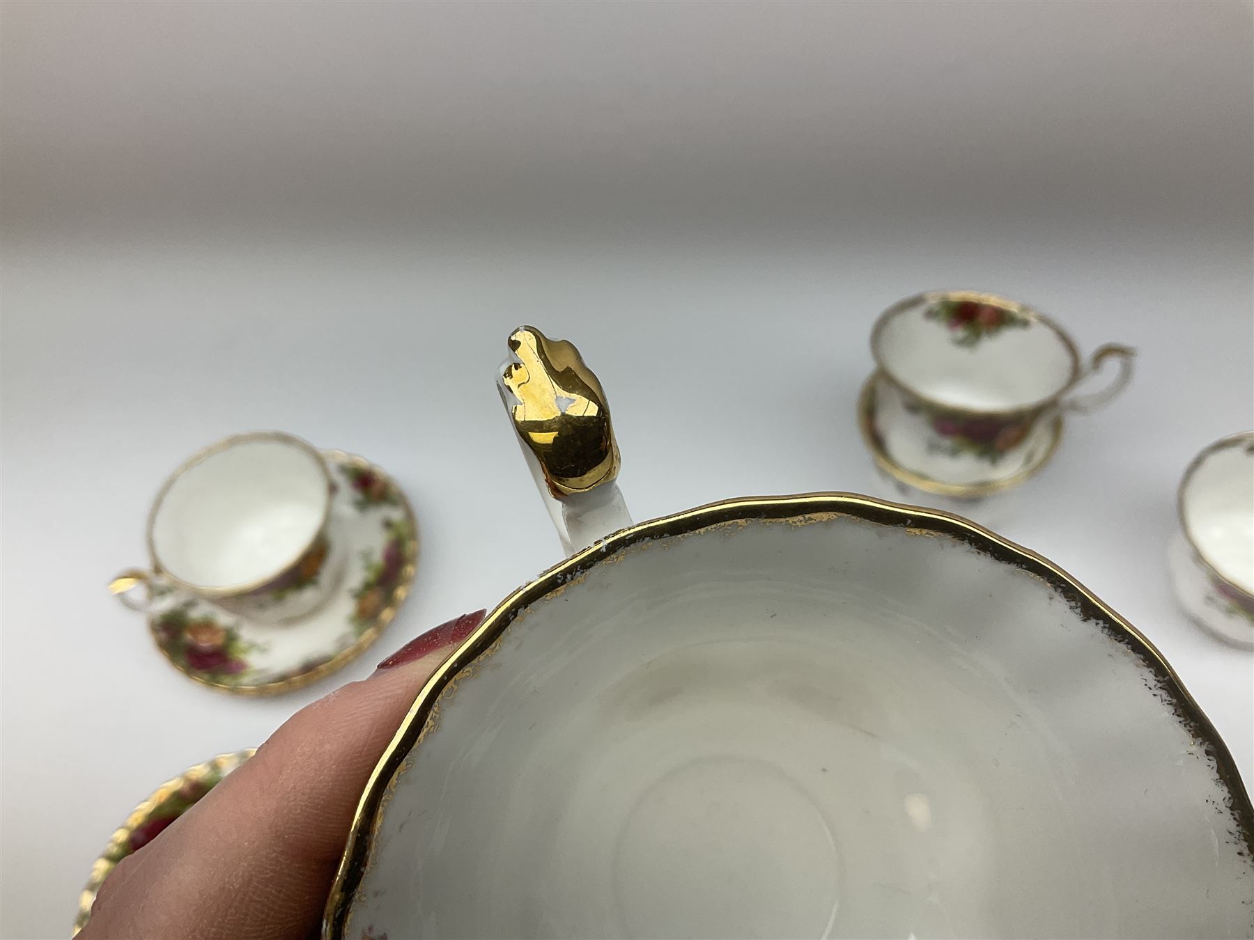 Royal Albert Old Country Roses pattern tea set, comprising teapot, coffee pot, six teacups and six saucers, five side plates, further teacup with joined saucer and side plate, open sucrier, milk jug, cake plate, and preserve pot and cover, together with Royal Albert Jubilee Rose pattern sauce boat and stand, and Royal Albert Lavender Rose pattern cake stand. 