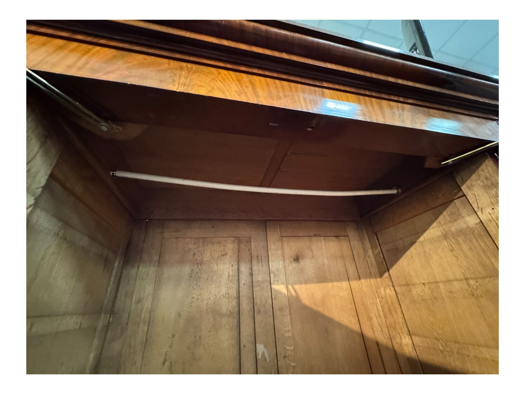 19th century mahogany break-fronted quadruple wardrobe, stepped and moulded projecting cornice over four arch panelled doors, moulded plinth base on blocks 