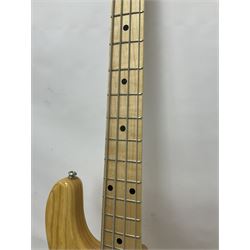 Ernie Ball Music Man Sting Ray 4 string bass guitar, in natural finish with roasted maple neck and tortoiseshell effect scratch guard, serial no 87485, in black Music Man hard case, guitar L114cm
