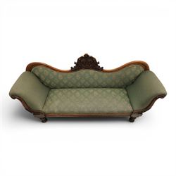 Victorian mahogany framed sofa, scroll arms with double camel back, green geometric upholstery, raised on turned supports