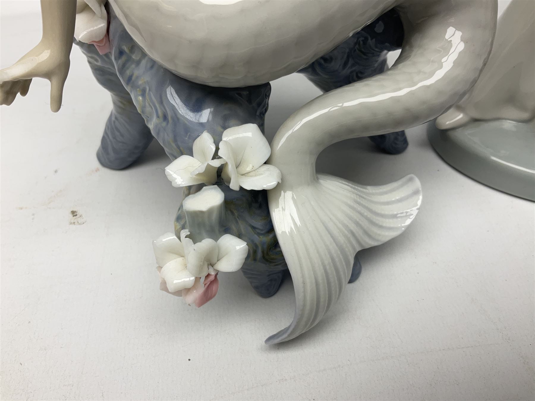 Four Lladro figures, comprising Touch of Class no 5377, Boy Student no 4517, Ocean Beauty no 5785 and Carnival Couple no 4882, largest example H45cm