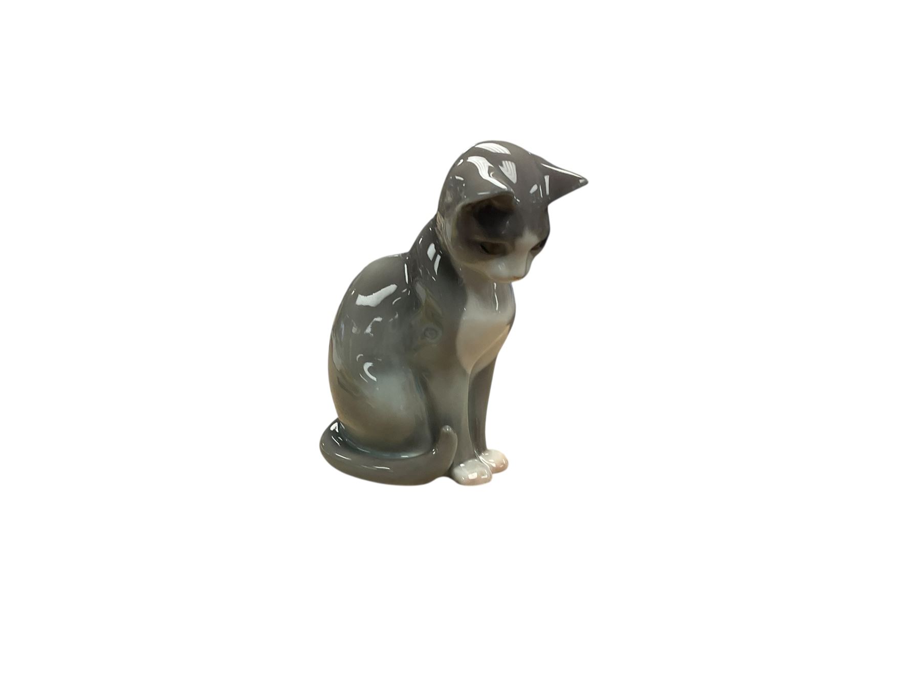 Two Lladro cat figures, comprising Cat and Mouse no 5236 and Kitty Confrontation no 1442, together with Royal Copenhagen cat and three other figures 