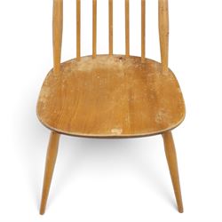 Ercol - 'Goldsmith' light elm set of four dining chairs, shaped cresting rail above seven spindles, dished seat raised on tapering supports with H-stretcher