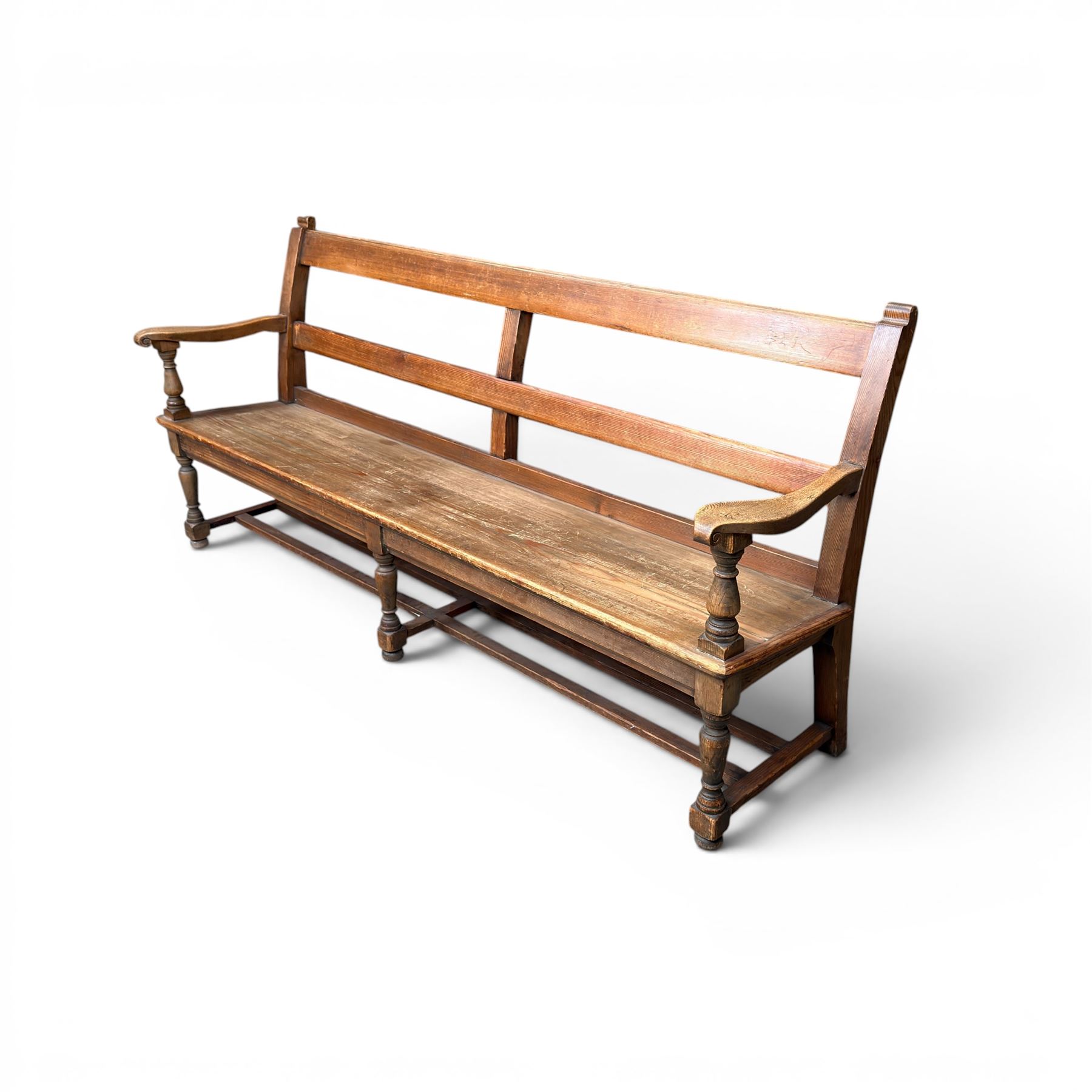 Early 20th century pine and oak bench seat, stained pine rail back frame with shaped oak arms