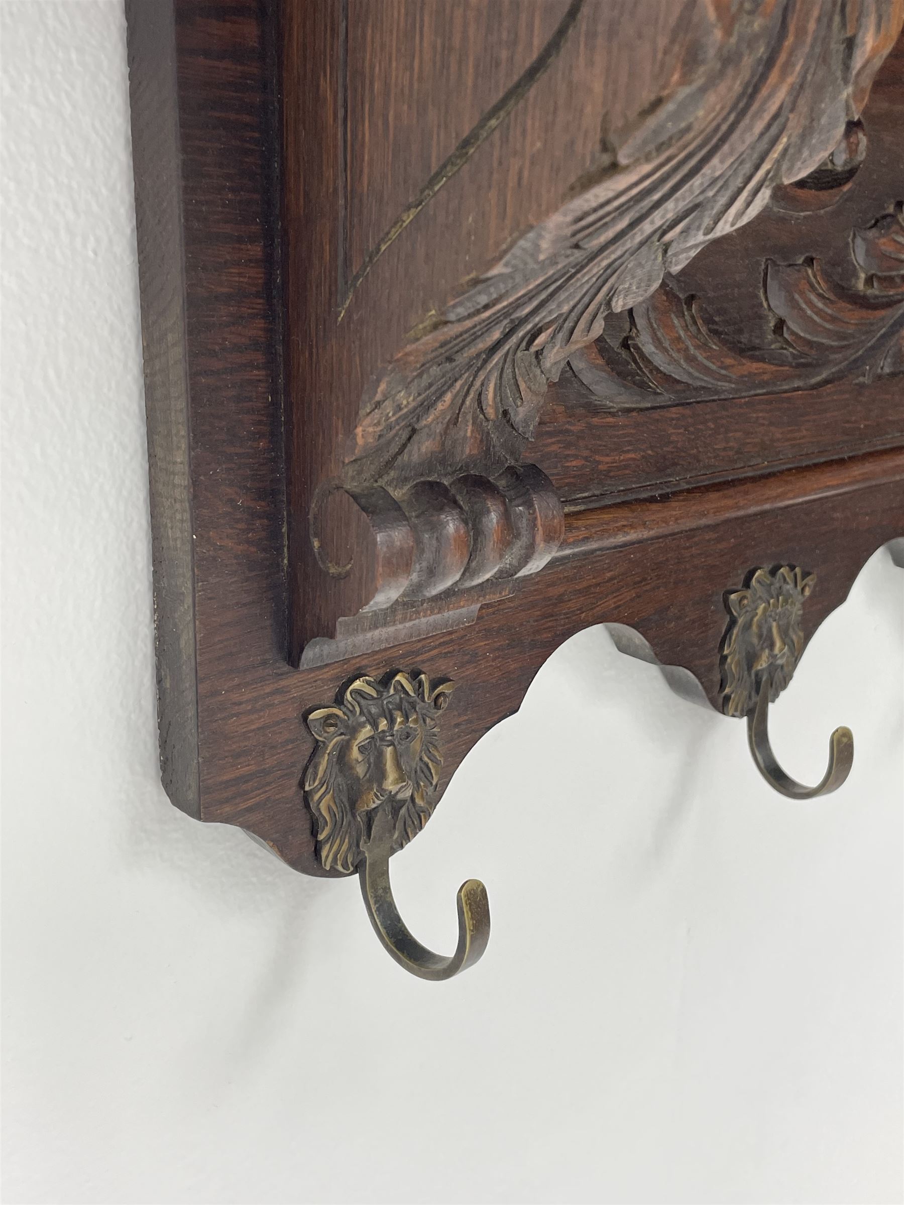 Mid to late century oak wall hanging coat rack, carved foliage