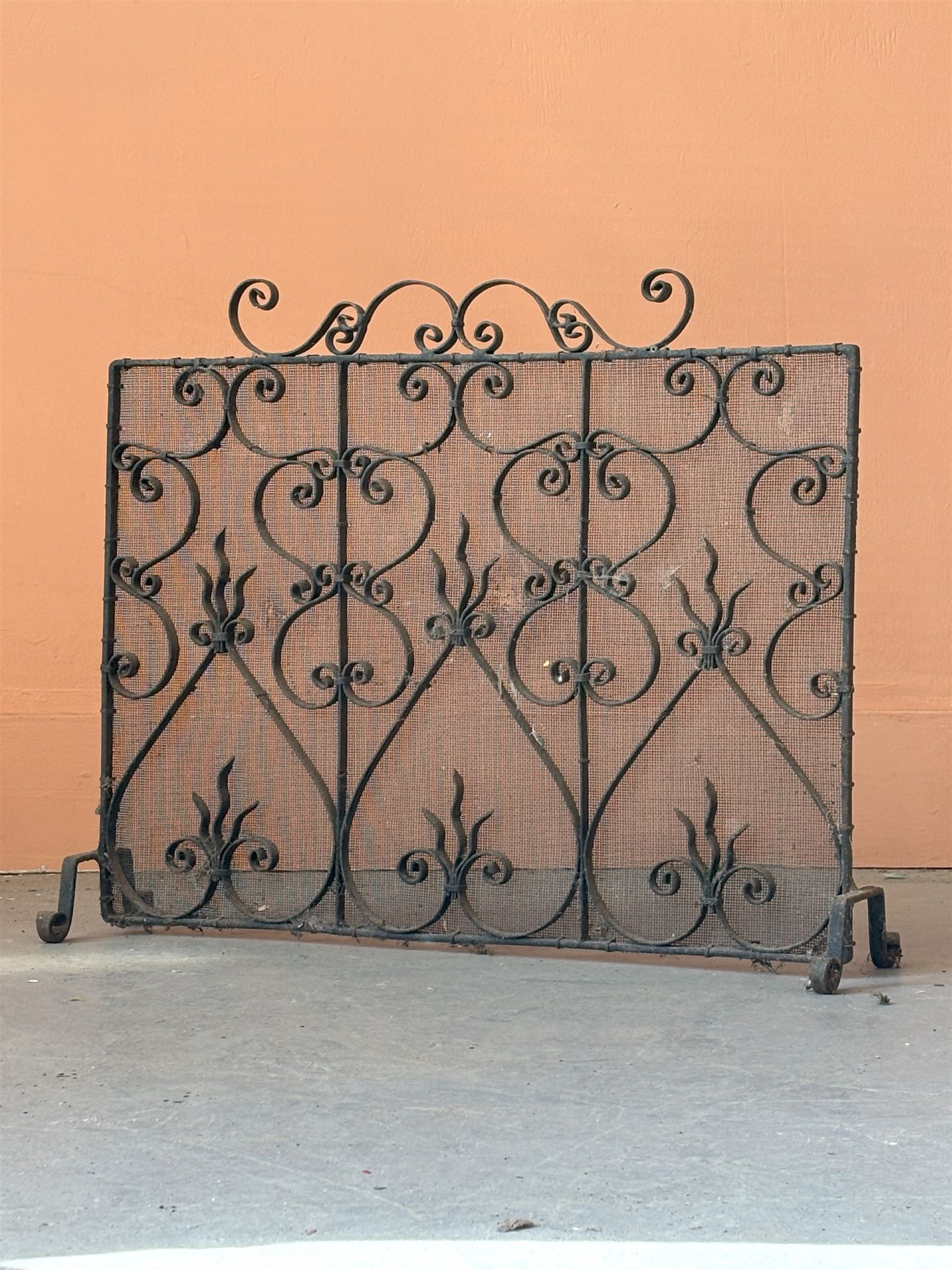 19th century wrought iron and mesh spark guard, decorated with conforming 'S' scrolls and standing on four out splayed supports (H53cm)  - COLLECTION BY APPOINTMENT FROM: The White House, Thirsk Road, Easingwold, York, YO61 3NF - CALL 01723 507111 TO ARRANGE