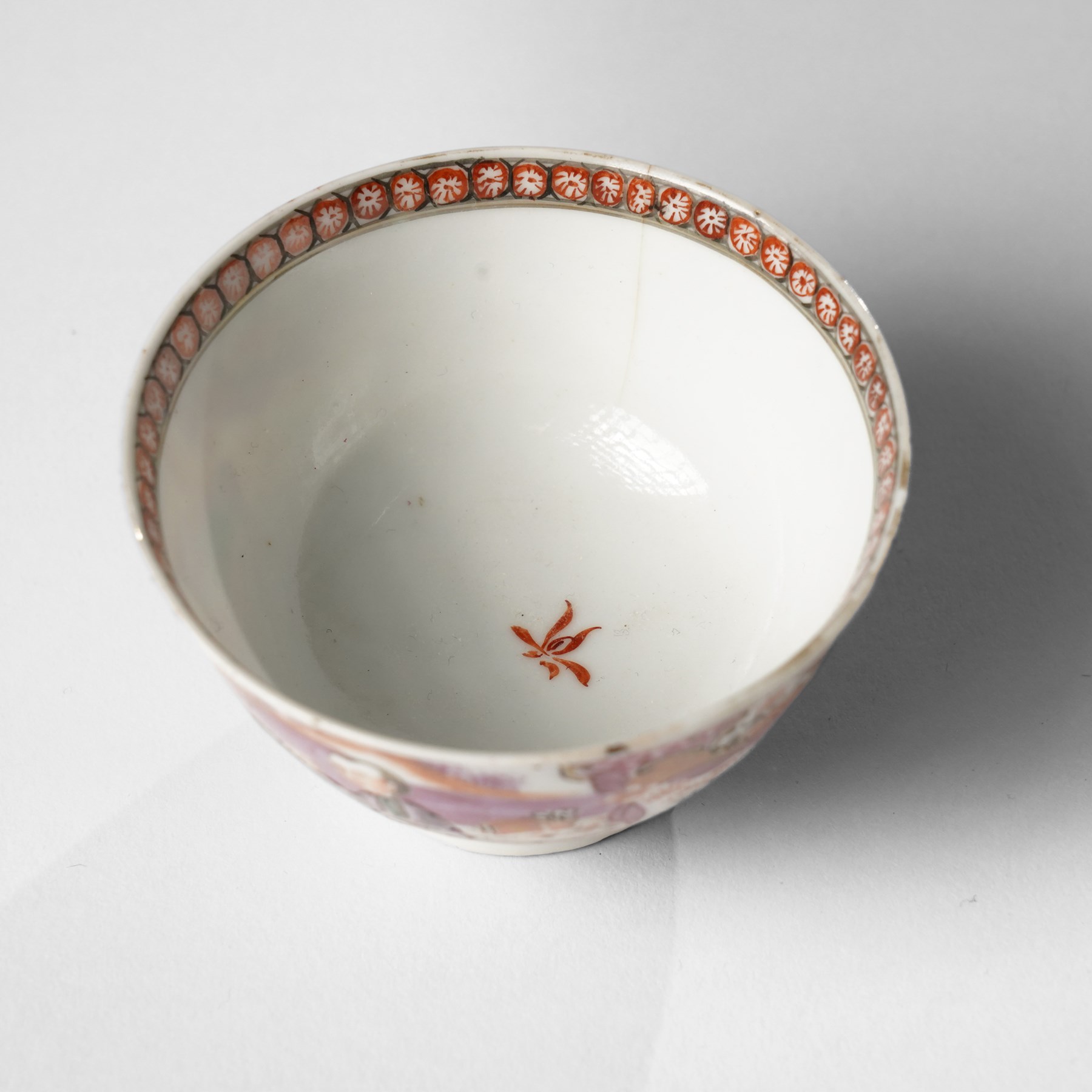 Two pairs of 18th/19th century Chinese export tea bowls and saucers, the first decorated in the 'Mandarin Palette' in typical colourways, the other famille rose examples painted with figures near a window, all unmarked (4)