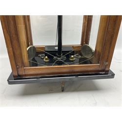 Set of laboratory balance scales by Reynolds & Branson of Leeds in fully glazed mahogany case with rise-and-fall front door, black vitrolite base with brass feet and hand cranked action L40cm H51.5cm D30cm; and bakelite cased set of brass weights