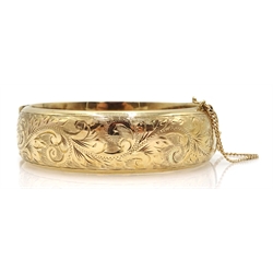  9ct gold bangle with engraved decoration, Birmingham 1987, approx 30gm  