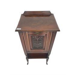 Edwardian walnut fall-front music cabinet, rectangular top with raised back, moulded and carved floral front panel concealing three-part cupboard, under-tier with spindle supports, raised on cabriole feet