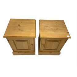 Pair pine bedside cabinets, fitted with single panelled cupboard door