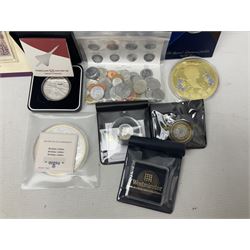 Coins and sets, including Great Britain and Northern Ireland 1970 proof coin collection in card folder, Queen Elizabeth II 2021 'Through the Looking Glass' five pounds, 2021 'Winnie the Pooh' fifty pence, Queen Victoria 1887 halfcrown, King George V 1914 halfcrown, commemorative coins, The Royal Mint Solomon Islands 2003 twenty-five dollars silver proof coin cased with certificate, 9ct gold half sovereign mount etc