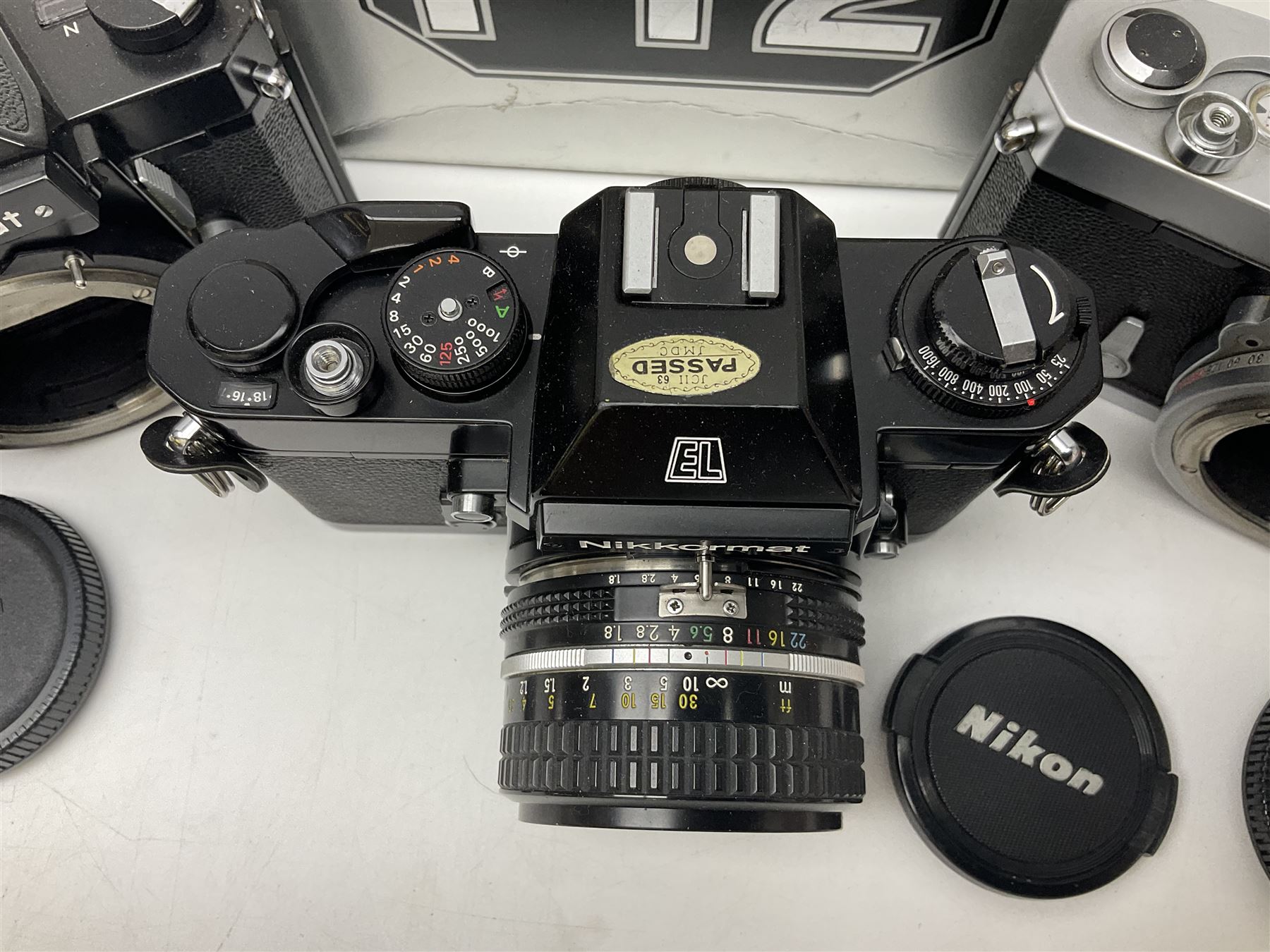 Nikkormat FT2 camera body, serial no. 5066813, in original packaging, together with Nikkormat EL camera body, serial no. 5577358, with Nikon Nikkor 50mm 1:1.8' lens no. 2143575, Nikkormat FT, serial no. 3968385, and Nikomat FT camera body, serial no. 4015491