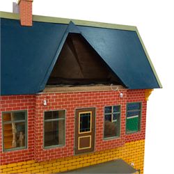 Moritz Gottschalk three storey wooden dolls house model 3589, with two side openings, with blue roof, painted exterior and wallpapered and painted interior, similar example featured in 'The Genius of Moritz Gottschalk' book, page 57, including chimney H100cm