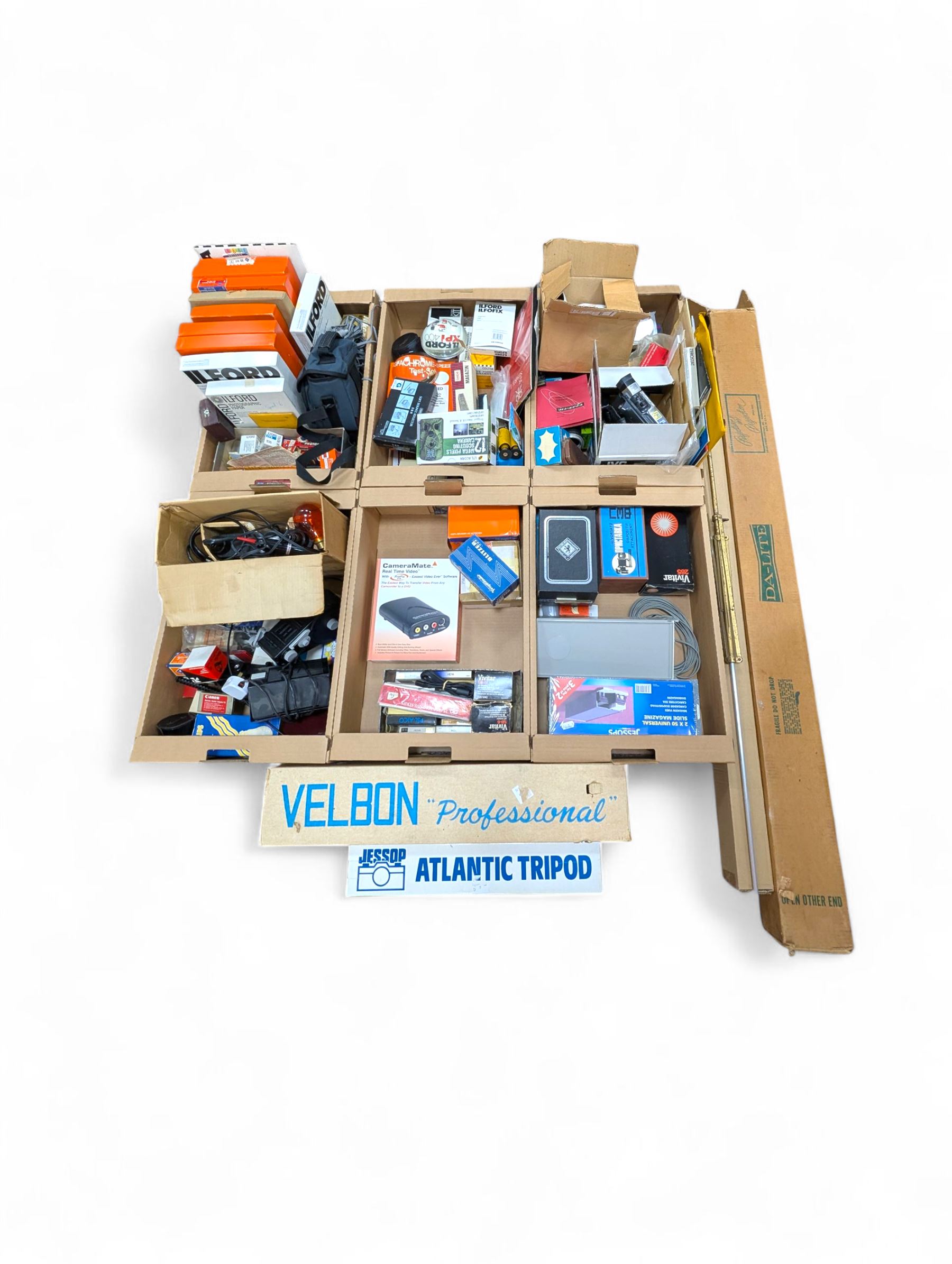 Large collection of photography equipment, including two video cameras JVC and a Panasonic 3CCD, tripods, filters, photograph paper, developing equipment, Dalite projector screen, etc, some boxed some empty boxes, and a Midgard Pocket Microscope