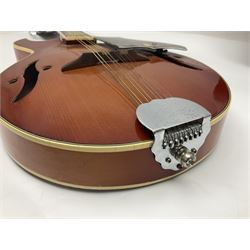 Eastern eight-string mandolin with sunburst finish and mother-of-pearl inlay L68.5cm; and another Harmony mandolin with cracked headstock (2)