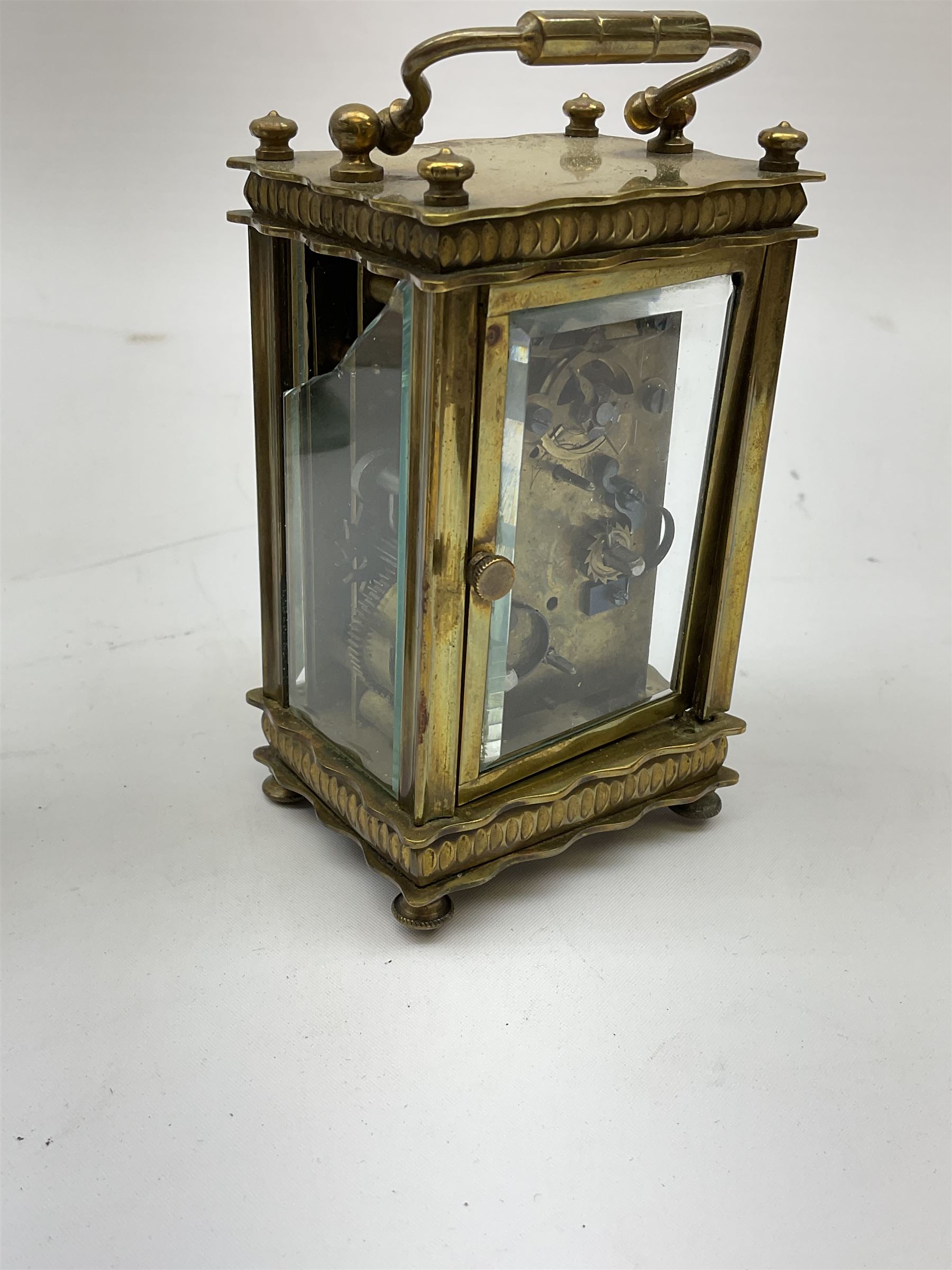 Miniature 'Zenith' travel alarm clock, in engine turned brass case with