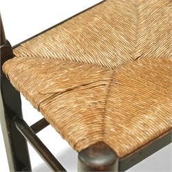 20th century set of five spindle-back dining chairs, with shaped top rails above turned spindle splats, rush seats, turned forelegs united by stretchers