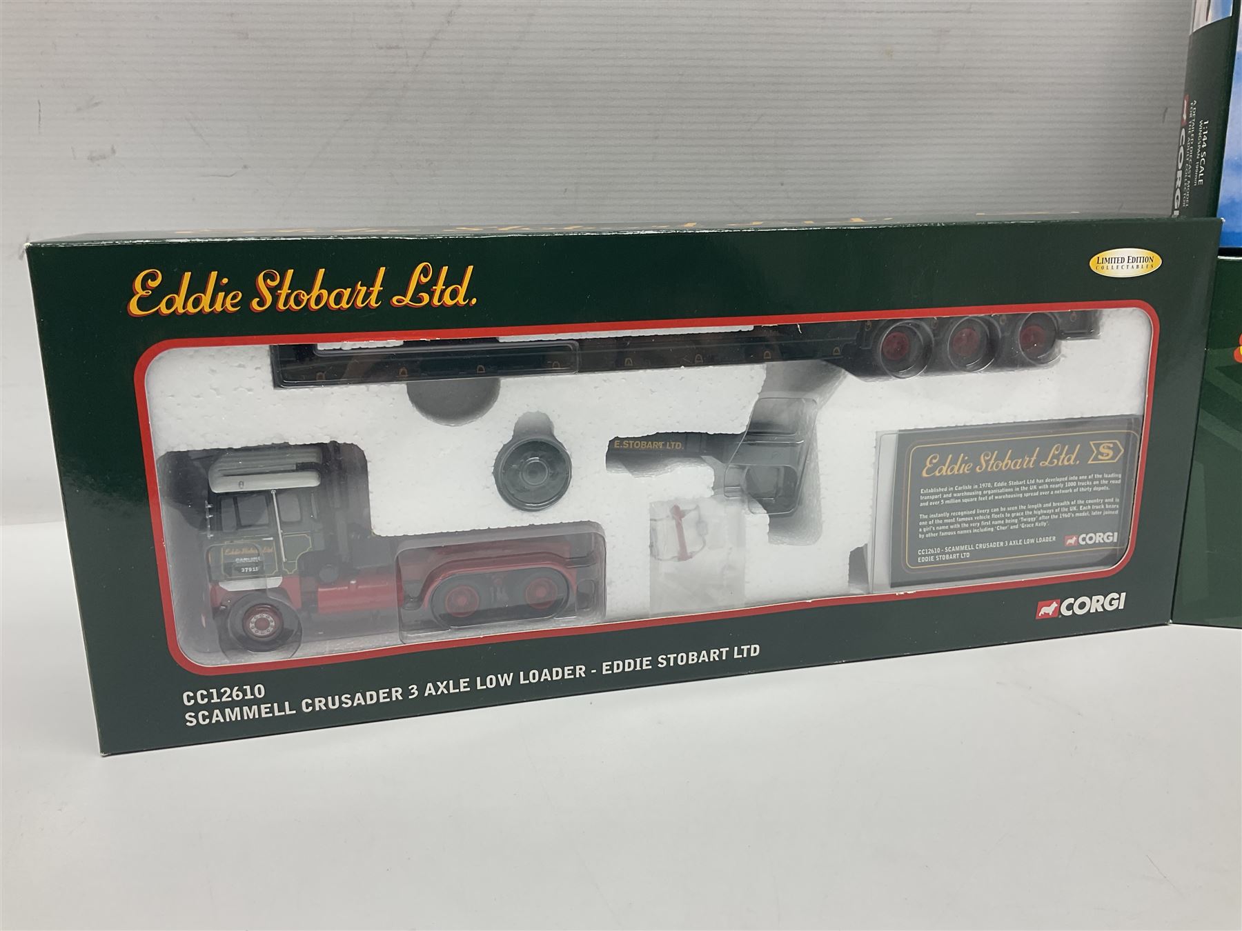 Corgi Eddie Stobart - four heavy haulage vehicles comprising 75201 ERF Curtainside; 75403 Leyland-DAF Curtainside; both in plastic display boxes; CC12610 Scammell Crusader 3 Axle Low Loader; and CC12502 Atkinson Borderer Flatbed Trailer; together with AA30008 Douglas DC-3 Aircraft; all boxed (5)