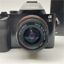 Sony Alpha 7R ILCE-7R camera body, serial no. 3985804, with 'Voigtlander Super Wide-Heliar f/4.5 15mm' lens, serial no. 9250212, camera with charger and in original box