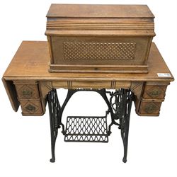 Early 20th century walnut cased 'Singer' treadle sewing machine, serial no. R164607 
