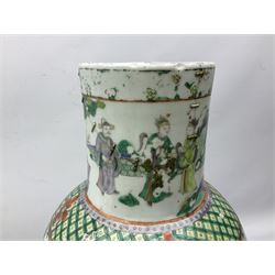 Chinese Famille Verte covered vase of baluster form, with  elongated cylindrical neck, painted with figures in a variety of poses, with foo dog decoration on cover, H64cm