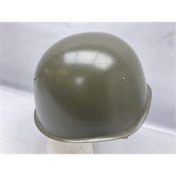 Two 1960s East Block Soviet style helmets - Czechoslovakian and Russian; both with liners (2)