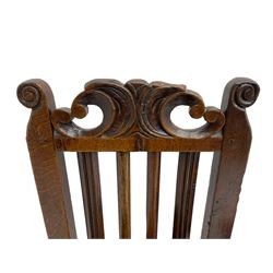 Set of three 18th century oak chairs, the cresting rail carved with C-scrolls and foliate, moulded upright and plain rails, plank seat, on turned and block supports with turned middle stretcher 