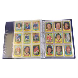 Collection of Football related trading cards, stickers and coins, including 1990 Esso World Cup Coin Collection, an empty 2010 Esso Official England Medal Collection Folder, incomplete 1990 Italy World Cup Commemorative Medal Collection, 1998 The Official England Squad Medal Collection, 1970s Topps All Stars Cards, 1992 Panini Official Football Players cards, Euro 2008 Collectors Binder and Cards, Panini 2009/10 Champions League Stickers, etc housed in four folders