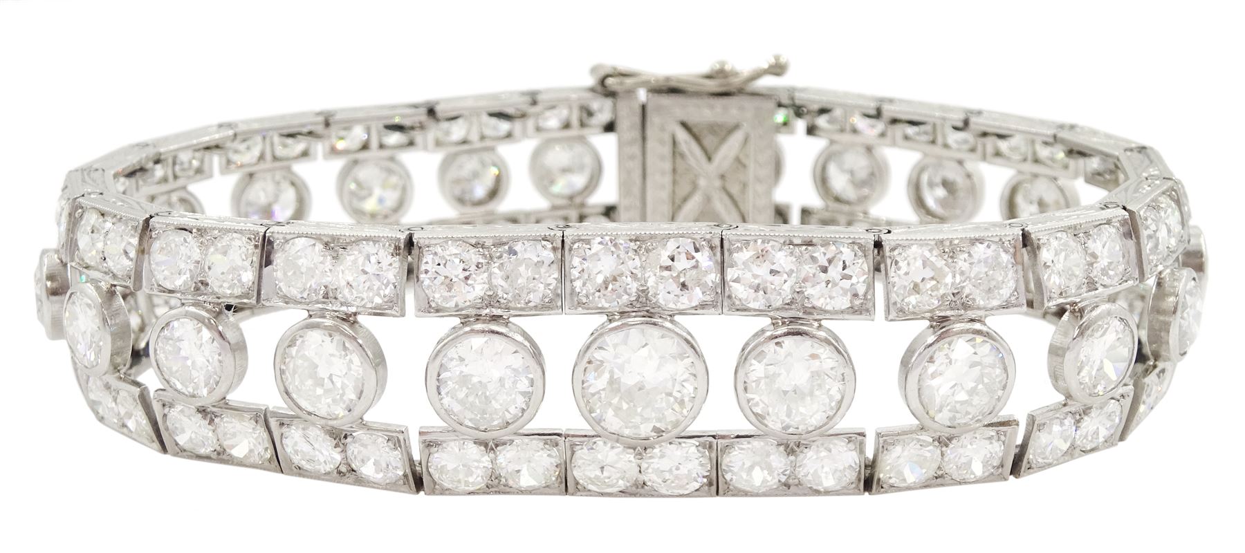 Continental Art Deco platinum old cut diamond openwork bracelet, circa 1920's, twenty-two bezel set graduating diamonds of approx 9.45 carat, the principal diamond approx 0.90, with a row milgrain set diamonds either side, the clasp set with a single diamond, the bracelet sides and clasp with engraved foliate decoration, total diamond weight approx 20.60 carat