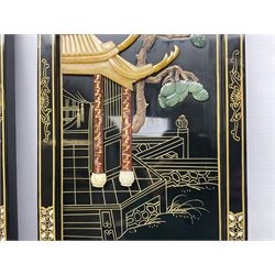 Two 20th century Chinese lacquered wall plaques, decorated in relief with female figures playing instruments beneath a pagoda, within gilt and mother of pearl inlaid borders, H92cm