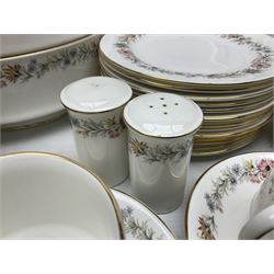 Royal Albert Paragon tea and dinner service for twelve decorated in the Belinda pattern, comprising fourteen saucers, twelve teacups, thirteen side plates, teapot, sauce boat and stand, salt and pepper shakers, two jugs, sucrier, twelve dinner plates, twelve smaller plates, two lidded tureens, twelve bowls, twelve smaller bowls, cake plate, oval plate and oval dish (100)