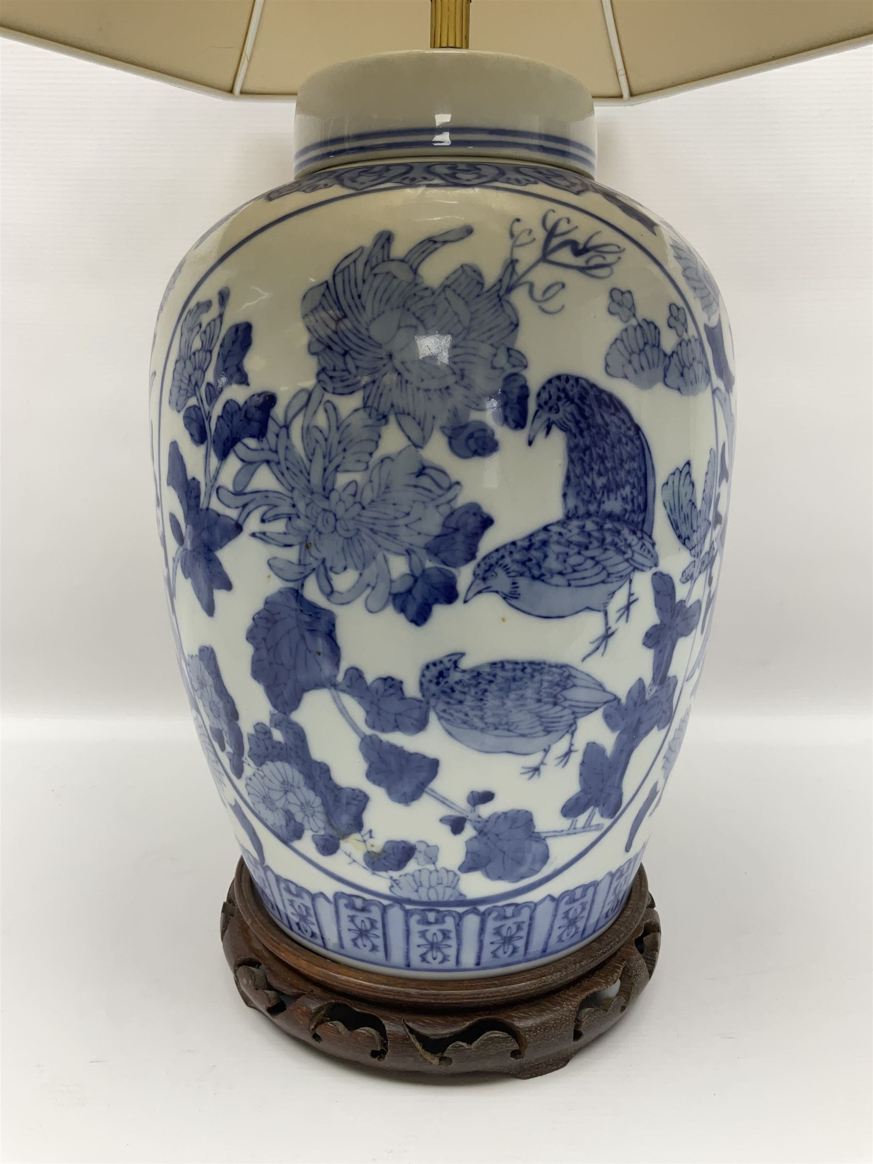Chinese blue and white table lamp of baluster form, decorated with birds and floral displays, on hardwood base with shade, H78cm