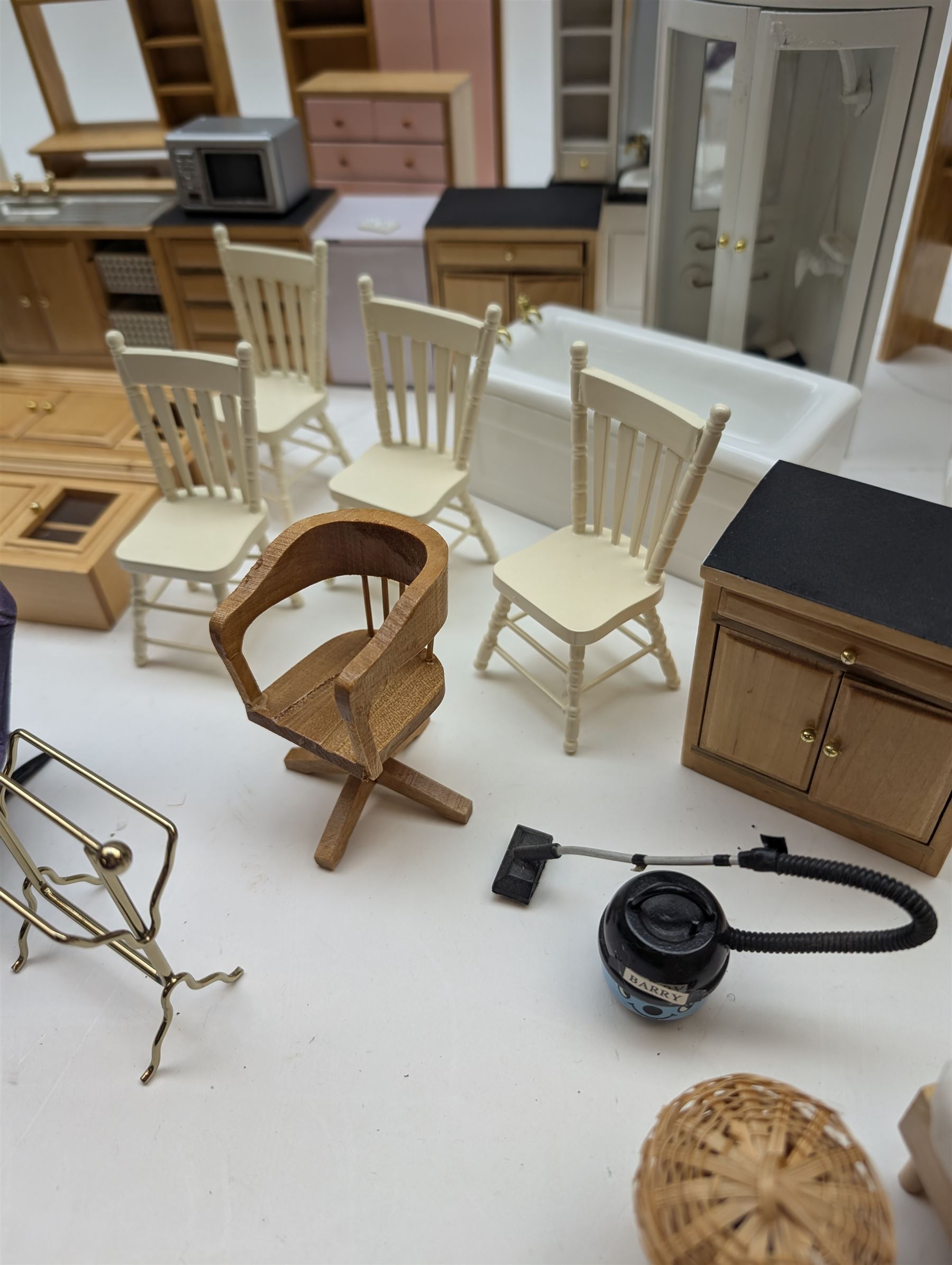 Modern 1:12 scale dolls house furniture, comprising pine kitchen set, with wall cabinets, floor cabinets and sink unit, white wooden bathroom suite, white wooden kitchen and dining room furniture and appliances, wooden bedroom furniture, Raine purple wingback chair, tv, desk, fish tank, etc