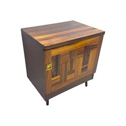 Troeds of Sweden - mid-20th century rosewood veneered cupboard, single door with brass handle enclosing interior fitted with one drawer, raised on ebonised tapered and splayed supports
