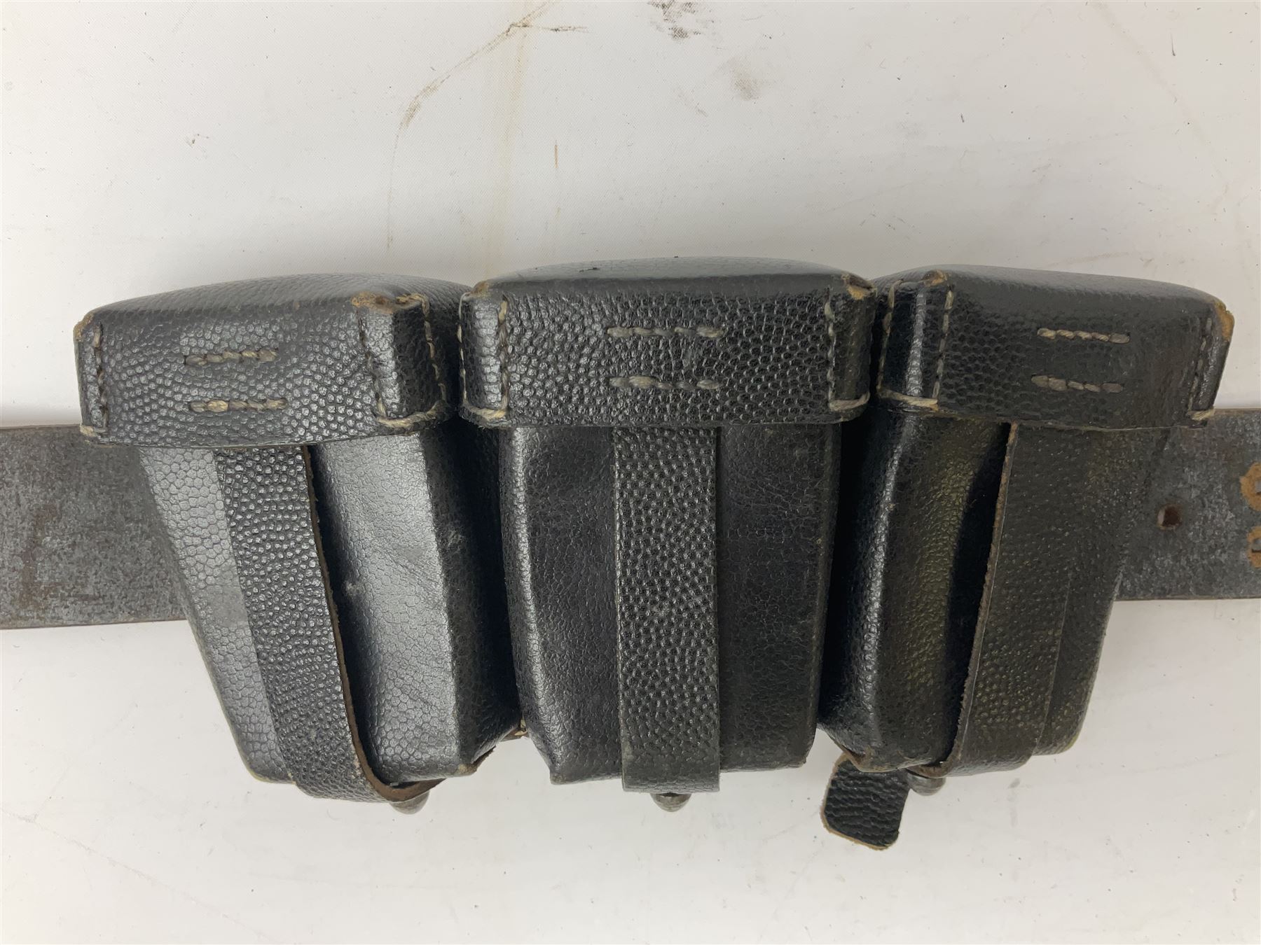 WW2 German 'SS' leather belt with six pouches (one containing unused field bandage) and buckle inscribed 'Meine Ehre Heifst Treue'; belt marked 0/0836 0029