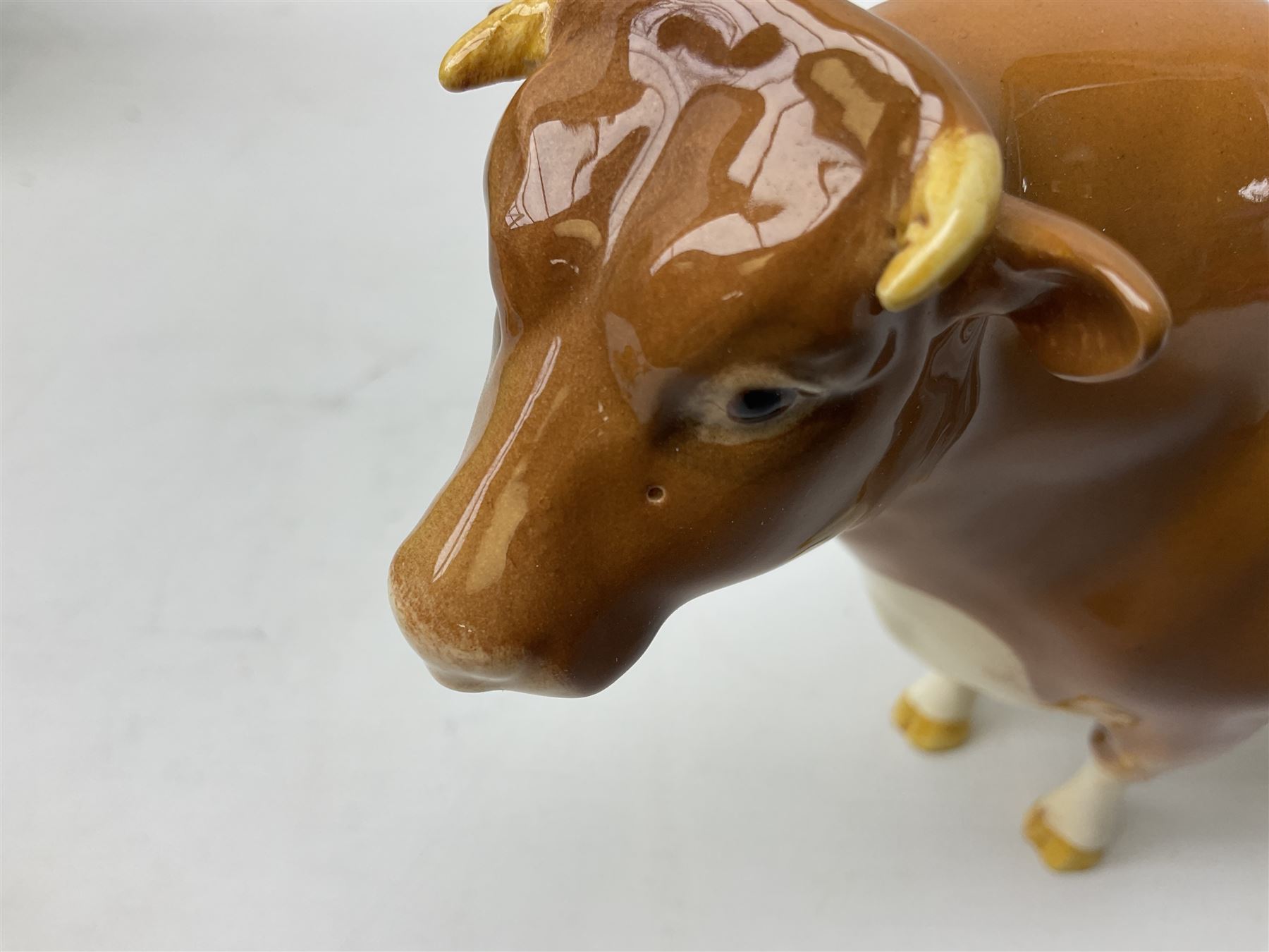 Beswick Guernsey cow family group, comprising bull 'Sabrina's Sir Richmond' no 1451, cow no 1248a and calf no 1249a, all with printed mark beneath and with original boxes 