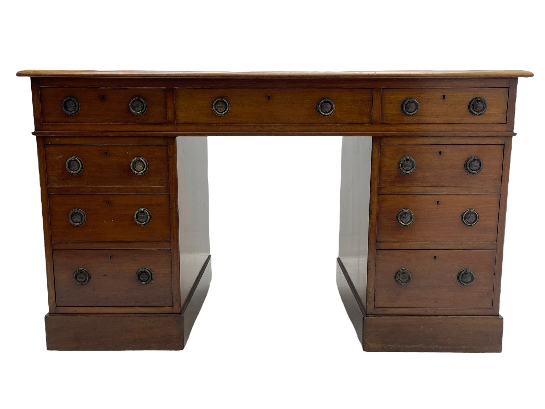 Howard & Sons. - 19th century walnut twin pedestal desk, moulded rectangular top with tooled leather inset, fitted with nine drawers with circular pressed brass handle plates decorated with urns, each drawer fitted with a 'Hobbs, London' lock, on plinth base, the upper right-hand drawer stamped 'Howard & Sons, Berners St.' and with paper label