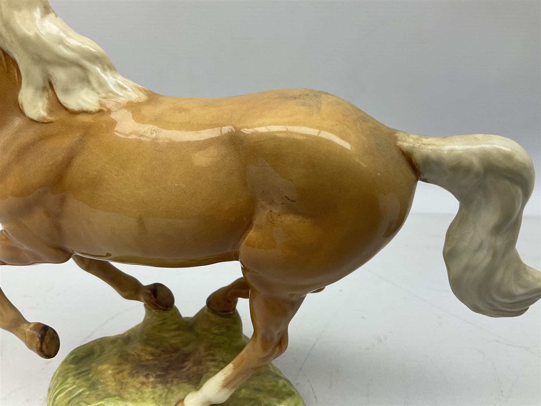 Beswick figure of cantering Palomino horse on base model no 1374, with impressed and printed mark beneath, H18cm
