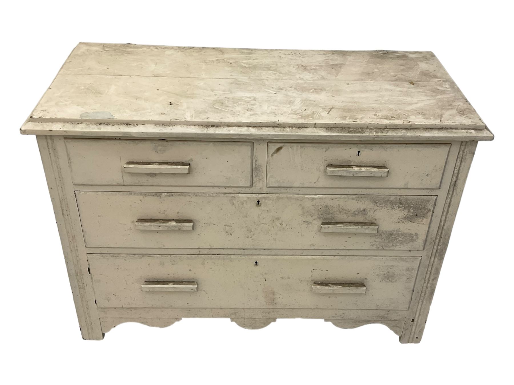 20th century painted pine chest of drawers, rectangular top over two short and two long drawers, scalloped apron, on castors