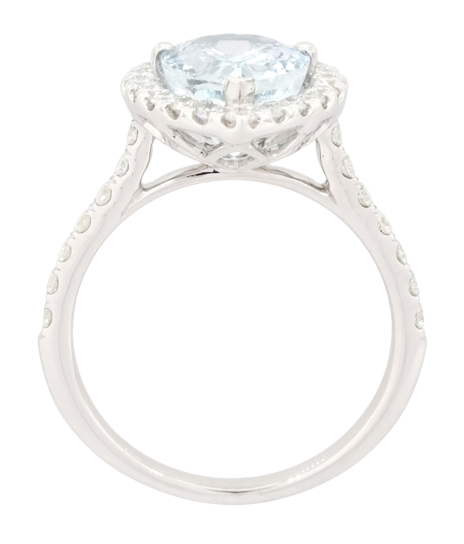 White gold aquamarine and diamond cluster ring, single pear cut aquamarine of approx 2.75 carat, surrounded by round brilliant cut diamonds and diamond set shoulders, hallmarked 9ct